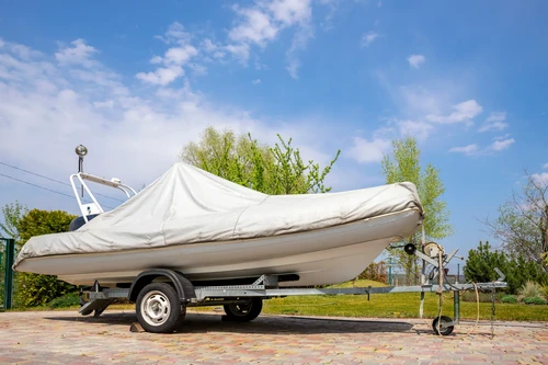 Boat covered with tarp type cover outside